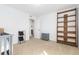 Charming bedroom with hardwood floors, built-in shelves, and plenty of natural light at 9785 Mount Kataka Pt, Littleton, CO 80125