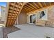Covered patio with stone flooring and bench at 9785 Mount Kataka Pt, Littleton, CO 80125