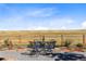 Metal patio furniture set on gravel patio with view of open space at 9785 Mount Kataka Pt, Littleton, CO 80125