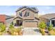 Two-story house with solar panels and a welcoming front porch at 9785 Mount Kataka Pt, Littleton, CO 80125