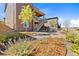 Landscaped backyard with patio and stairs to lower level at 9785 Mount Kataka Pt, Littleton, CO 80125