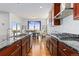 Kitchen with granite countertops, stainless steel appliances, and hardwood floors at 9785 Mount Kataka Pt, Littleton, CO 80125