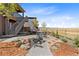 Landscaped backyard with patio and seating area at 9785 Mount Kataka Pt, Littleton, CO 80125