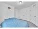 Well-lit bedroom with double doors and carpet flooring at 4072 N Rome St, Aurora, CO 80019