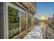 Private deck with snow and view of neighboring homes at 4072 N Rome St, Aurora, CO 80019