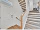Modern light wood staircase with carpeted steps at 4072 N Rome St, Aurora, CO 80019