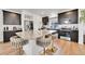 Granite island kitchen with stainless steel appliances at 4072 N Rome St, Aurora, CO 80019