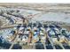 Aerial view of neighborhood with houses and snowy landscape at 4072 N Rome St, Aurora, CO 80019