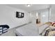 Bright bedroom with a large bed and access to a bathroom at 4072 N Rome St, Aurora, CO 80019
