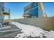 Private backyard with snow, gravel, and a fence at 4072 N Rome St, Aurora, CO 80019
