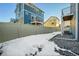 Private backyard with snow, gravel, and a fence at 4072 N Rome St, Aurora, CO 80019