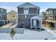 Rear view of two-story home with gray siding at 4072 N Rome St, Aurora, CO 80019