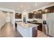 Modern kitchen with island, stainless steel appliances, and granite countertops at 4316 Canyata Dr, Elizabeth, CO 80107