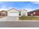 Tan two-car garage home with front yard and driveway at 6280 Indian Paintbrush St, Frederick, CO 80530