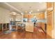 Spacious kitchen with an island, stainless steel appliances, and light wood cabinets at 6280 Indian Paintbrush St, Frederick, CO 80530