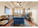 Living room with sectional sofa and accent chair at 6280 Indian Paintbrush St, Frederick, CO 80530