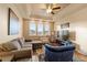 Cozy living room featuring a sectional sofa and accent chair at 6280 Indian Paintbrush St, Frederick, CO 80530