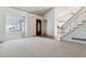 Spacious living room with vaulted ceilings and staircase at 17935 E Bethany Dr, Aurora, CO 80013