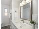 Bathroom with a quartz vanity top and updated fixtures at 840 Marble St, Broomfield, CO 80020