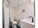 Clean basement bathroom, featuring a toilet and sink with modern fixtures at 17826 E Ada Dr, Aurora, CO 80017