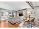 Spacious living area with hardwood floors and a unique wood feature wall at 1624 N Gilpin St, Denver, CO 80218