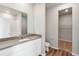 Bathroom with vanity, toilet and linen closet at 2985 Oxley St, Strasburg, CO 80136