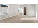 Bedroom with window, carpet and view of another room at 2985 Oxley St, Strasburg, CO 80136