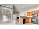 Kitchen with oak cabinets, granite counters, and black appliances at 10165 E Carolina Pl # 102, Aurora, CO 80247