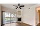 Living room with fireplace and sliding door to patio at 10165 E Carolina Pl # 102, Aurora, CO 80247