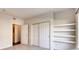 Bedroom with double door closet and built-in shelves at 10165 E Carolina Pl # 102, Aurora, CO 80247