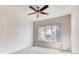 Spacious bedroom with a ceiling fan and a large window at 10165 E Carolina Pl # 102, Aurora, CO 80247