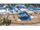 Aerial view of house and surrounding area, showcasing the property's location and landscape at 4285 Mohawk Dr, Larkspur, CO 80118