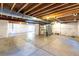 Unfinished basement with high ceilings and ample storage space at 4285 Mohawk Dr, Larkspur, CO 80118