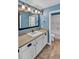 Clean bathroom with single vanity and a shower/tub combo at 4285 Mohawk Dr, Larkspur, CO 80118