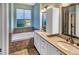 Spa-like bathroom with double vanity and soaking tub at 4285 Mohawk Dr, Larkspur, CO 80118