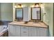 Elegant bathroom with double vanity, large mirrors, and a soaking tub at 4285 Mohawk Dr, Larkspur, CO 80118