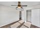 Bright bedroom with carpet, ceiling fan, and large closet at 4285 Mohawk Dr, Larkspur, CO 80118