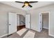 Bedroom with two doors, a closet and view of staircase at 4285 Mohawk Dr, Larkspur, CO 80118