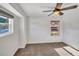 Cozy bedroom with carpet, ceiling fan, and a window with a view at 4285 Mohawk Dr, Larkspur, CO 80118