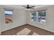 Spacious bedroom with carpet, ceiling fan, and multiple windows at 4285 Mohawk Dr, Larkspur, CO 80118