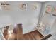 Open dining area with hardwood floors, a chandelier, and large windows at 4285 Mohawk Dr, Larkspur, CO 80118