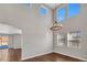 Spacious dining room with hardwood floors, large windows, and a chandelier at 4285 Mohawk Dr, Larkspur, CO 80118