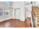 Bright entryway with hardwood floors, high ceilings, and elegant staircase at 4285 Mohawk Dr, Larkspur, CO 80118