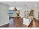 Open concept kitchen with island and views from large window at 4285 Mohawk Dr, Larkspur, CO 80118