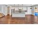 Open concept kitchen with island and stainless steel appliances at 4285 Mohawk Dr, Larkspur, CO 80118