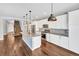 Modern kitchen with white cabinets and granite countertops at 4285 Mohawk Dr, Larkspur, CO 80118
