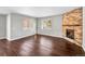 Spacious living room with hardwood floors and stone fireplace at 4285 Mohawk Dr, Larkspur, CO 80118