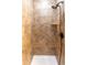 Shower with tiled walls and a handheld shower head at 4285 Mohawk Dr, Larkspur, CO 80118