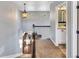 Upstairs hall with carpet, a bathroom, and a view to the lower level at 4285 Mohawk Dr, Larkspur, CO 80118