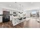 Modern kitchen with island and stainless steel appliances at 18129 E 99Th Pl, Commerce City, CO 80022